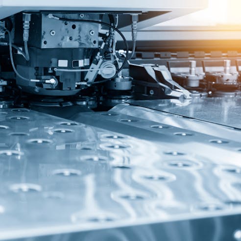 CNC punching. Image Credit: Shutterstock.com/Pixel B