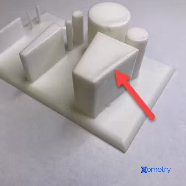 Edge pooling on a sharp edge of a vapor smoothed part