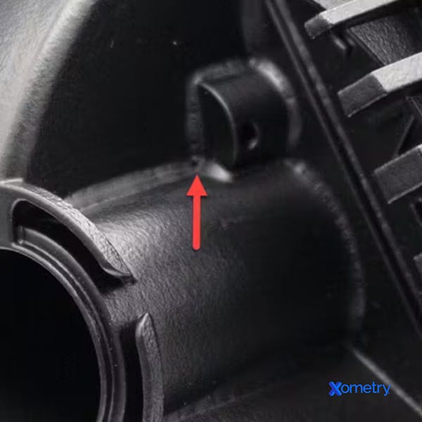 Close up photo of bridging defect on a vapor smoothed part