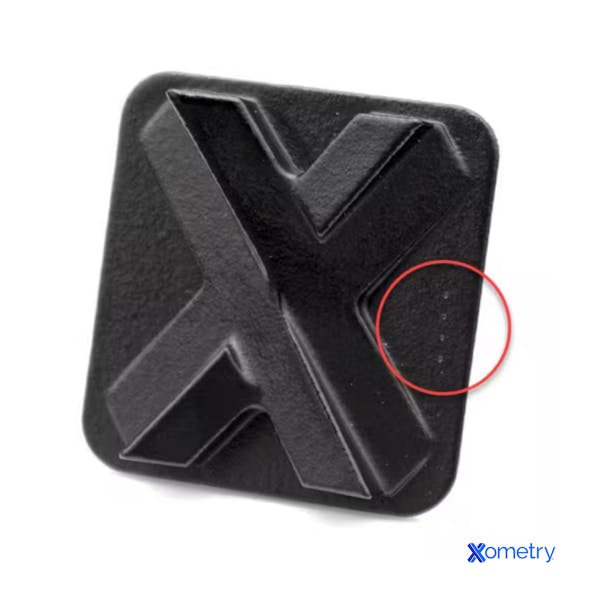 Close up of racking "bite marks" on a vapor smoothed part